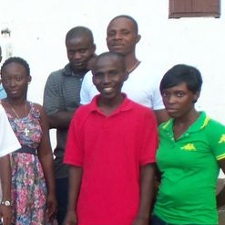 Mr Esau Wleh, wearing the red T-shirt