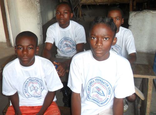 Kids wearing PE T-Shirts sitting in class