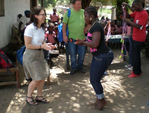 Lena and Veronica, a female teacher, playing knock foot