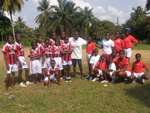 Girls of both schools posing with the referee (in middle) before the start of the game. Our girls are on the right.