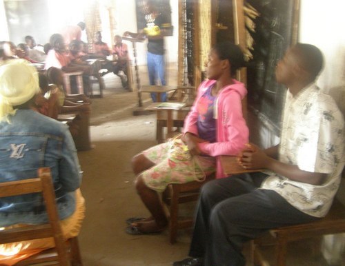 Staff members sitting during the program