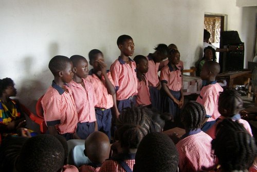 Kids of the second grade class doing a song at the program