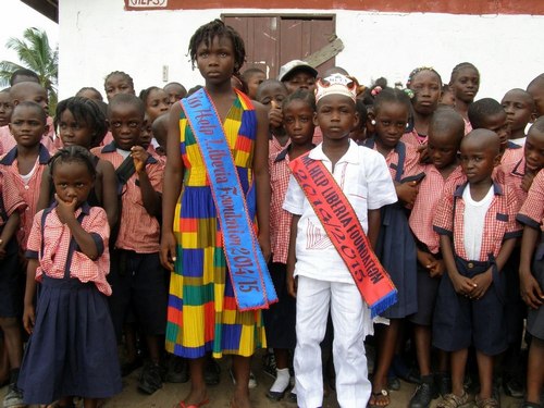 The King and the Queen posing with their subjects