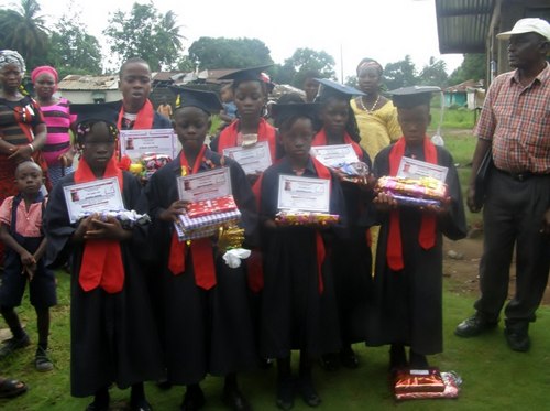 A cross-section of the graduates posing for after the program