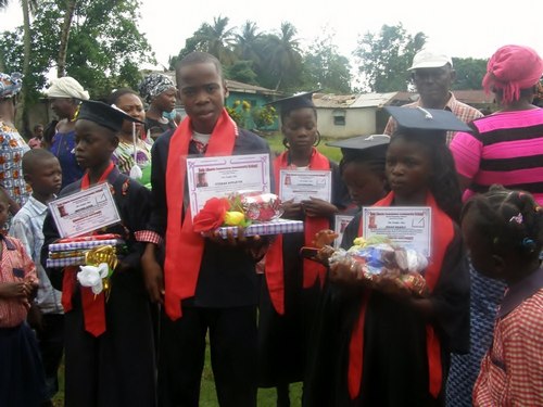 Some of the graduates – the bigger boy is the lone graduate from the Sixth Grade