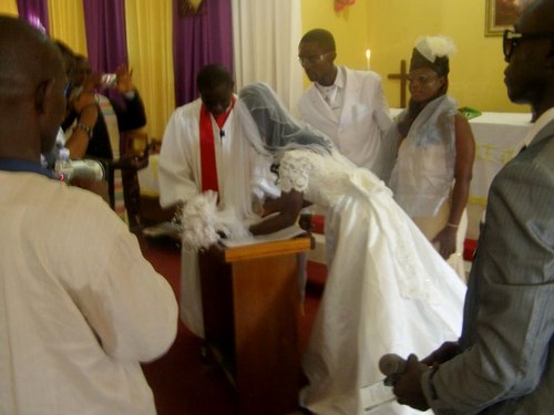 Couple signing their certificate