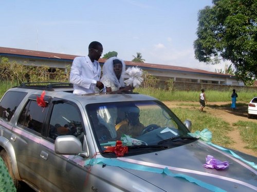 The Groom and the bride going on their honeymoon