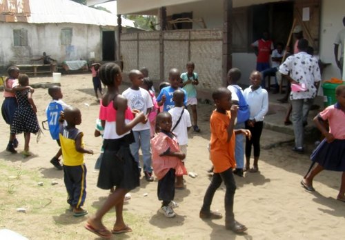 Kids standing outside during recess on Day One