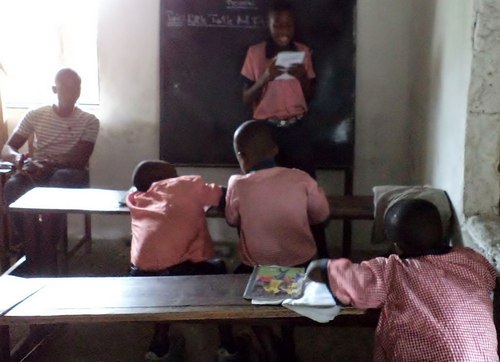 Kid reading in class in early June
