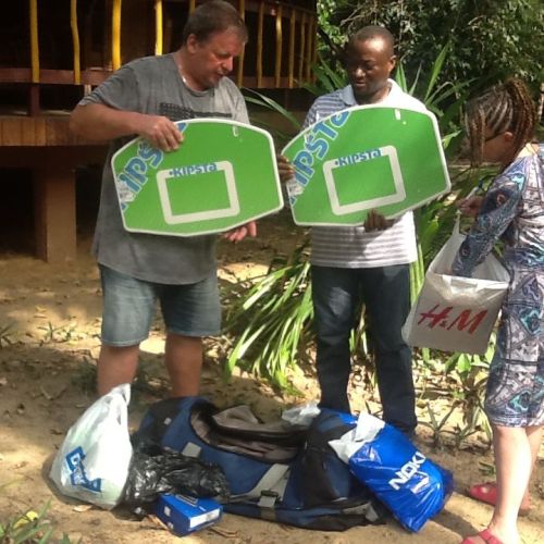 Anders and Lena showing Paul the items they have donated