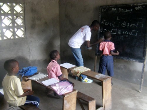 Teacher and students interacting in the K-4 classroom in the annex