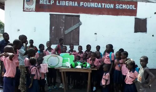Kids and staff with the donated items