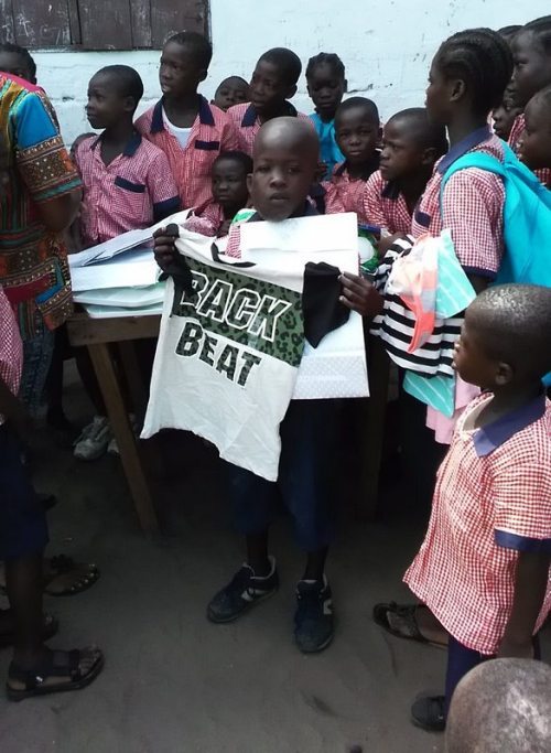 Solomon displays the t-shirt from his parcel