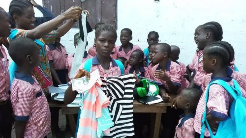 Susan displays additional items from her parcel, including her money