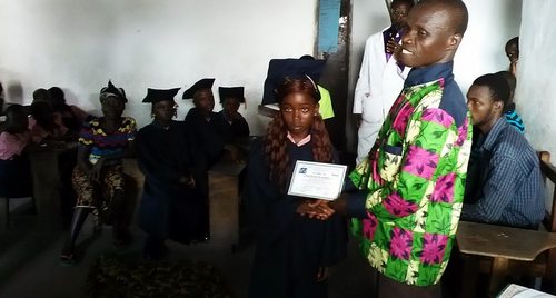 A graduate receiving certificate during the occasion