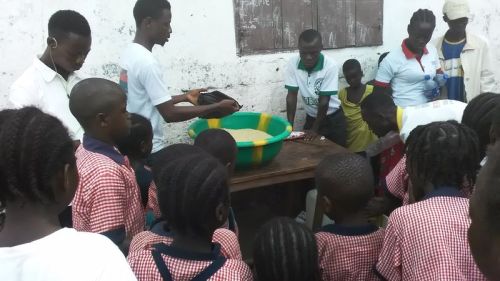 Staff and Kids standing around the distribution spot