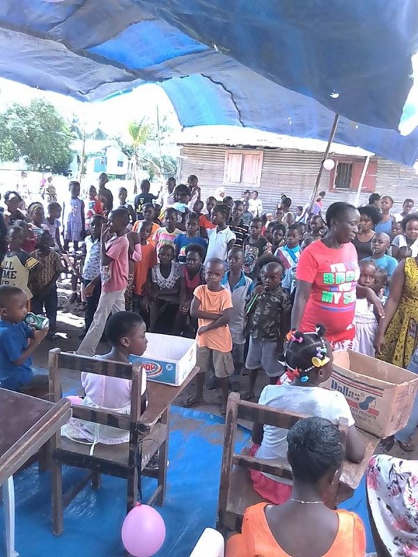 A cross-section of queens and kings sitting in front of the audience during the program