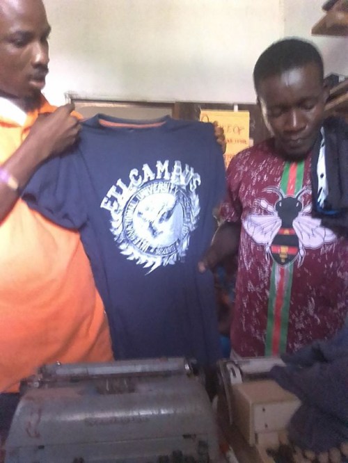 Staffers displaying clothes at the school