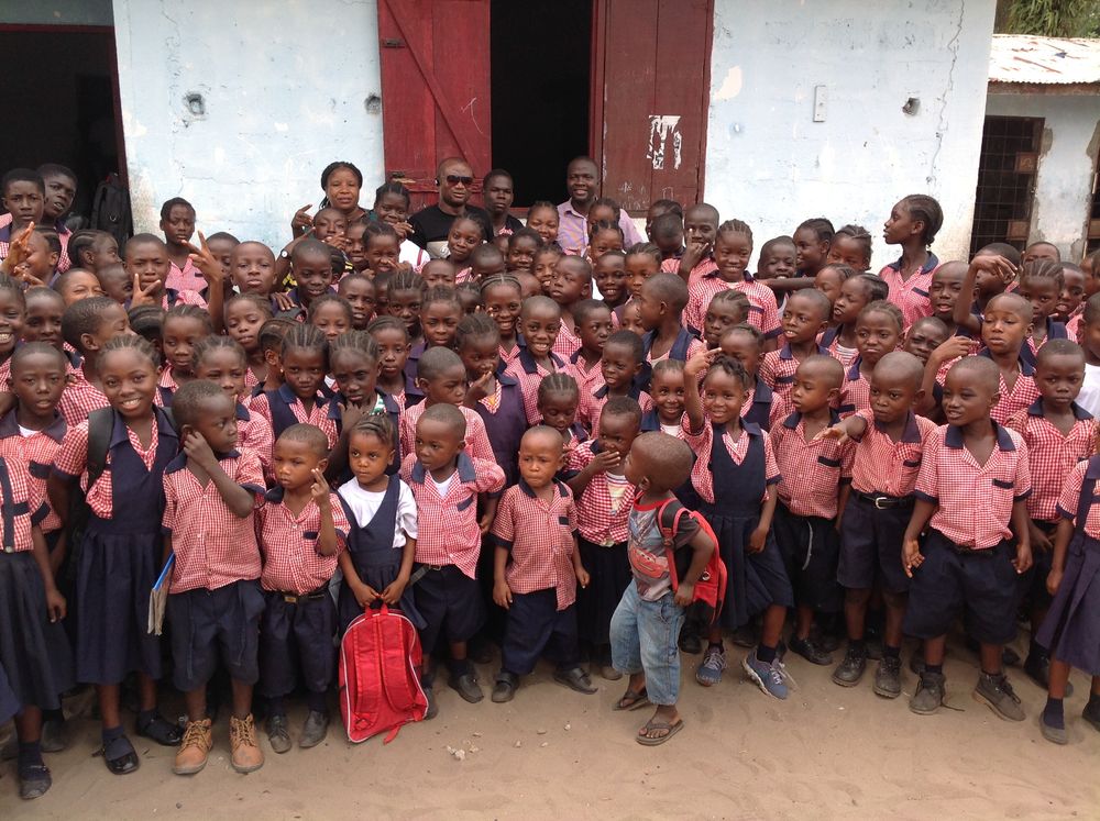 Board members, staffers and students posing after the meeting